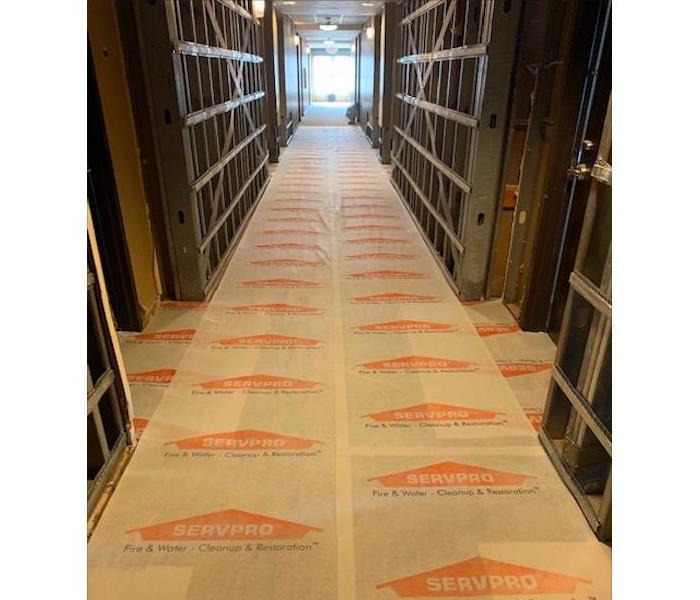 SERVPRO floor protection in commercial hallway.