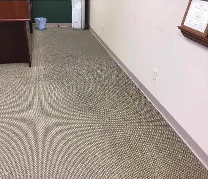 wet carpet in an office